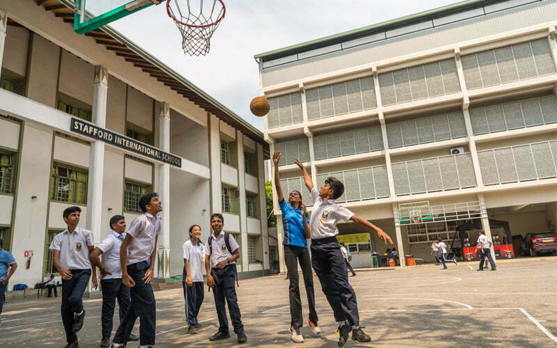 Students of SIS playing basketball